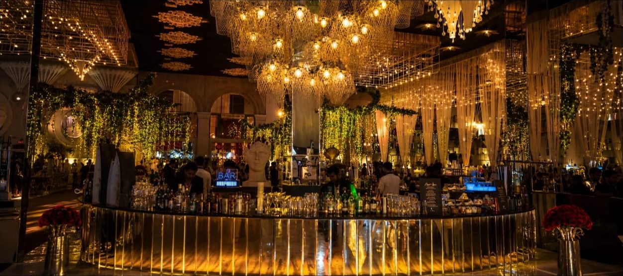 Grand round bar under gold chandeliers