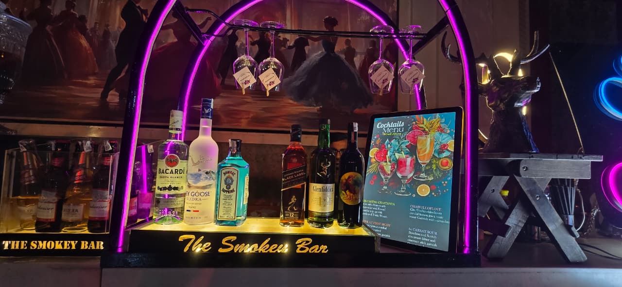 Purple neon arch bar with The Smokey Bar signage