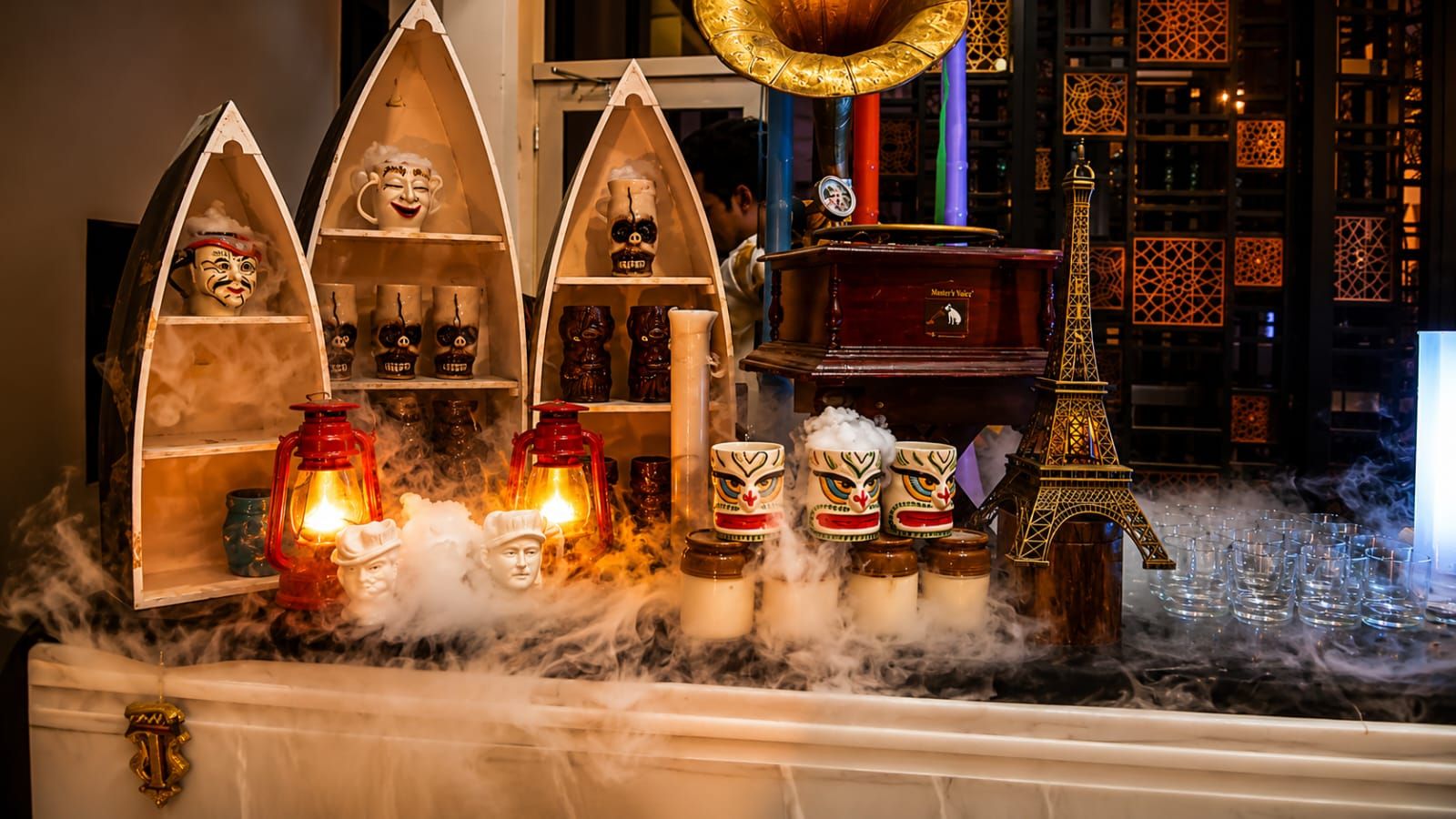Smoky tiki theme counter with Eiffel Tower and gramophone